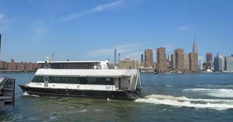 FERRY LEAVING NYC IN BACK GROUND Stock Footage 77601109