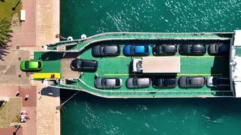 Ferry loading vehicles at dock with cars and passengers Stock Footage 339222189