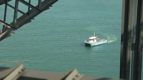 Ferry Navigates Sydney Harbour Under Bridge Structure, Aerial View in Australia Stock Footage 345723426