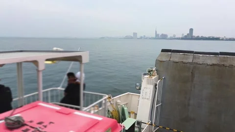 Ferry navigates through the calm waters of Hakata Bay. Stock Footage 335461882