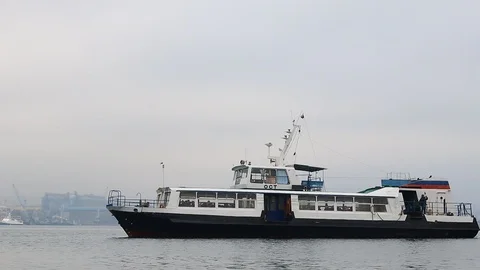 Ferry with passengers sailing in the bay Stock Footage 122947073