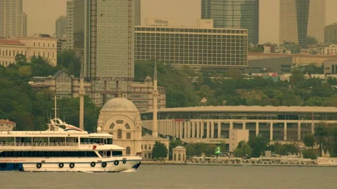 Ferry passes Dolmabahce Mosque Stock Footage 158666423