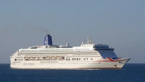 Ferry passing in front of P and O cruise ship Stock Footage 105213048