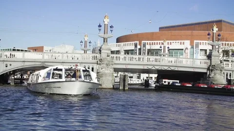 Ferry passing under the bridge Stock Footage 71535927