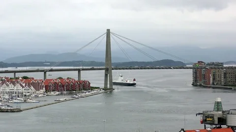 Ferry passing under road bridge Stavanger  Stock Footage 77266119