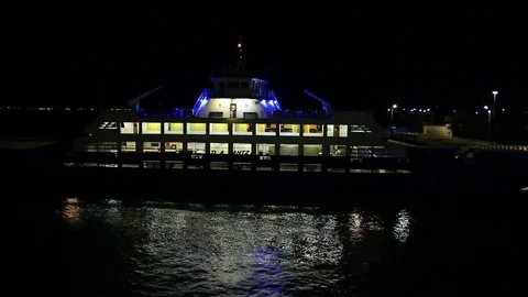 The ferry is at the pier at night Stock Footage 84547500