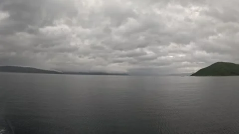 Ferry POV view of dramatic overcast cloudy sky over open fjord in Norway Stock-Footage 341814664