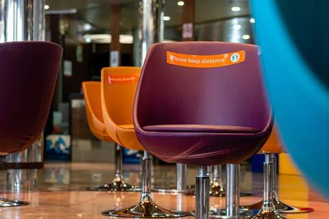 Ferry restaurant, empty seats with warning to keep social distance during cov Stock Photos