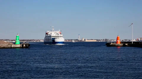 A ferry sailing between two lighttowers into harbor Stock Footage 40468426