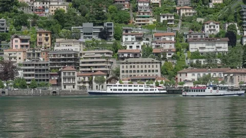 Ferry sailing on Como lake in the summer season Stock Footage 154328517