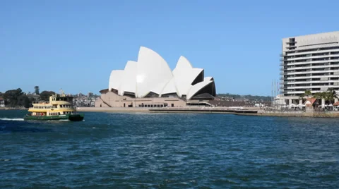 Ferry sailing past the Sydney opera house Stock Footage 34659272