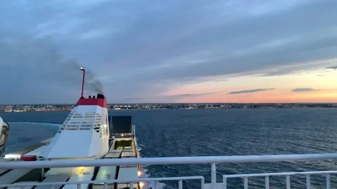 Ferry sailing at sunset Stock Footage 136948518