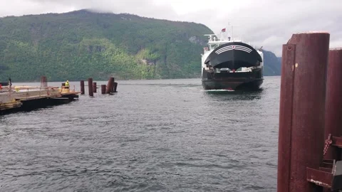 Ferry sailing towards pier while opening it gate, prapre to docking Video stock 325195547