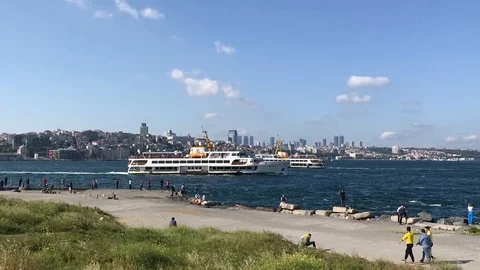 Ferry sails near the waterfront Stock Footage