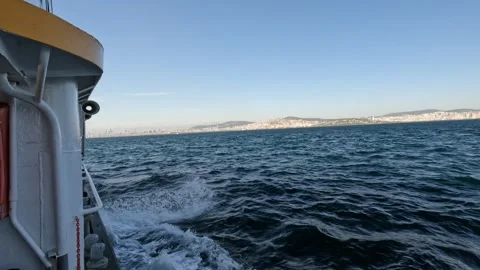 A ferry sails from the Princes' Islands toward Istanbul, Asian side in view Stock Footage 297885767