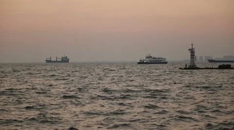 Ferry at sea with lighthouse Vídeos de archivo 55825971