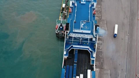 Ferry Ship Docked Beside Supply Vessel During Cargo Loading Stock Footage 343996428