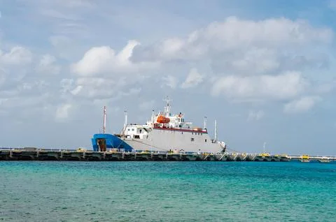 Ferry ship in docked harbor, side view. ferry ship in harbor or seaport. photo Stock Photos