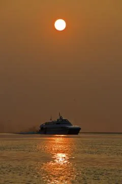 Ferry at sunset Stock Photos