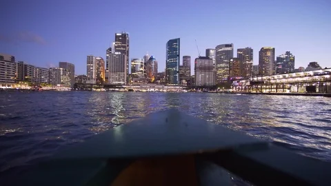 Ferry to Sydney CDB harbor with sunset illuminated city building Stock Footage 124909215
