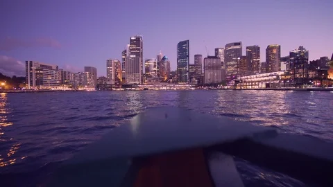 Ferry to Sydney CDB harbor with sunset illuminated city building Stock Footage 124978938