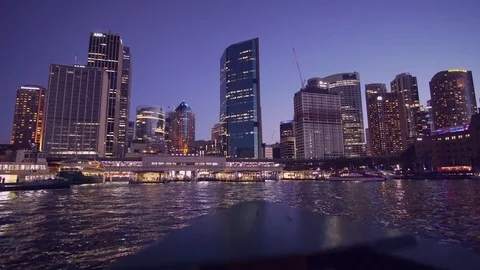 Ferry to Sydney CDB harbor with sunset illuminated city building Stock Footage 124979225