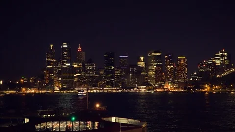 Ferry to Sydney CDB harbor with sunset illuminated city building Video stock 125121768