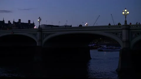 Ferry through arch way of Westminster bridge in the evening slow motion 4K Stock Footage 199751455