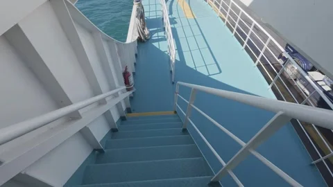 Ferry vehicle deck interior with stairs railings and safety equipment Stock Footage 338105397