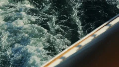 Ferry Wake Churning Through Deep Blue Ocean Water from a Deck Perspective 库存影片 331166371