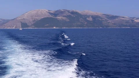 Ferry Wake Trail Through Deep Blue Aegean Waters With Barren Greek Mountain Stock Footage 318991893