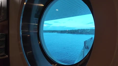 Ferry Window View Across Water Toward Wooded Shore Stock-Footage 347684135