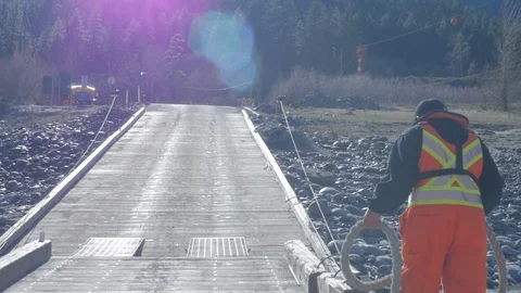 Ferry worker securing the ferry to the bridge Stock Footage 100397108