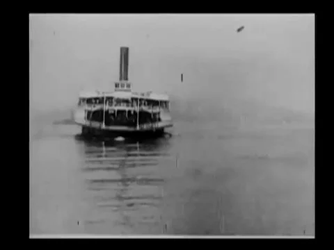 A ferryboat evacuates refugees to Oakland, in the aftermath of an earthquake, in Stock Footage