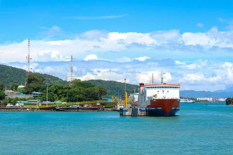 Ferryboat loading or unloading by a port pier. Stock Photos