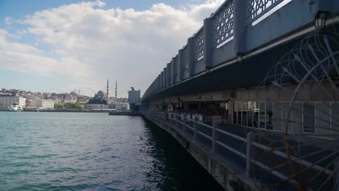 Ferryboat passing through galata bridge, under the galata bridge, istanbul Video stock 131035328