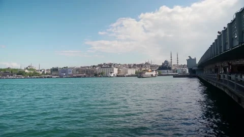 Ferryboat passing through galata bridge, under the galata bridge, istanbul Stock Footage 131084087