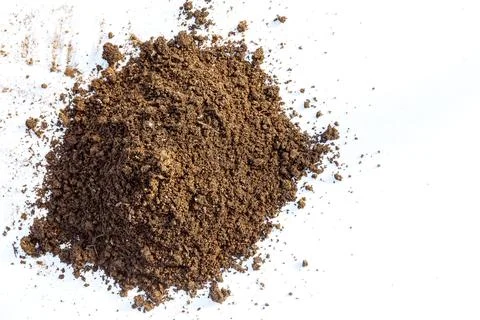 Fertile soil on a white background. The upper fertile layer of the earth in Stock Photos