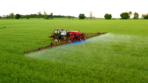Fertilization of fields. Agricultural machinery work. Aerial video. Stock Footage 144242960