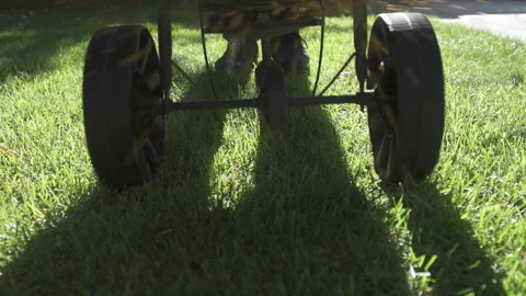 Fertilizer Spreader on Green Lawn Stock Footage 221586026