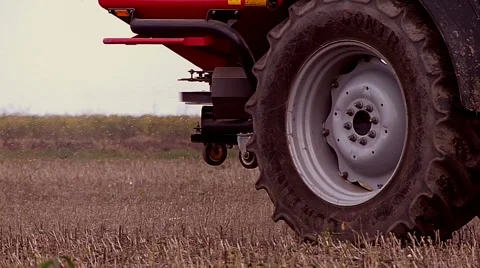 Fertilizer spreading on the field close up shot  Stock Footage 56309377