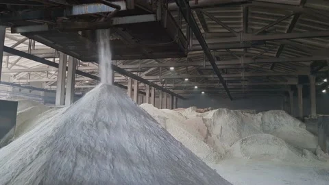 Fertilizers powder pour in a pile inside a warehouse of chemical plant. Video stock 160584891