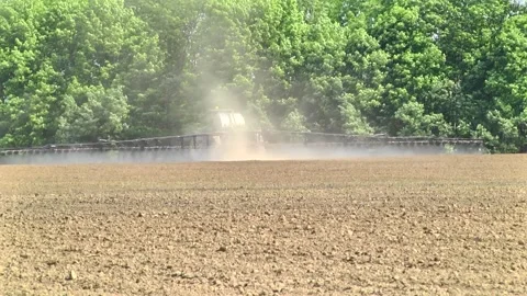Fertilizing for next year's harvest using a sprayer Stock-Footage 145935444