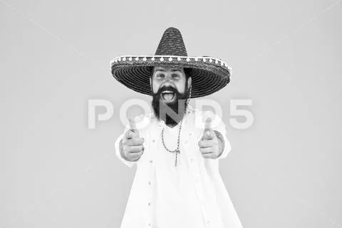 Fest and holiday. Celebrate traditions. hipster looks festive in sombrero Stock Photos