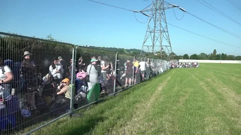 Festival-goers queue to enter Glastonbury Stock Footage 197951388