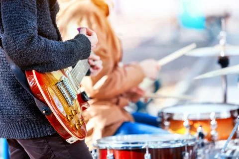 Festival music band. Friends playing on percussion instruments city park. Stock Photos