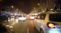 Festive atmosphere in night city, many cars on road, brightly illuminated street 4k or 4k+ Resolution