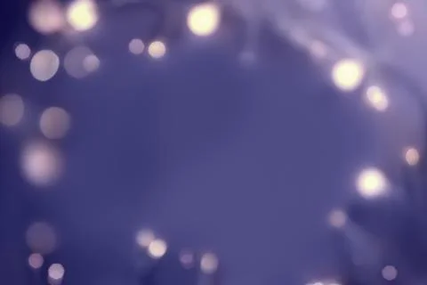 Festive backdrop for a postcard or web design. Frame made of a garland and bokeh Stock Photos