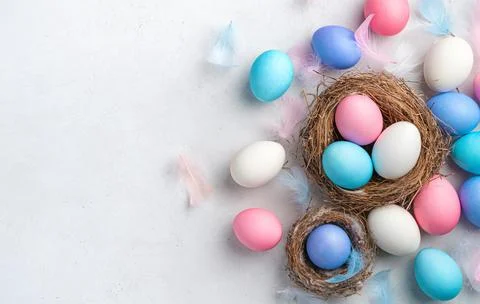 Festive background with Easter eggs on a gray background. Stock Photos