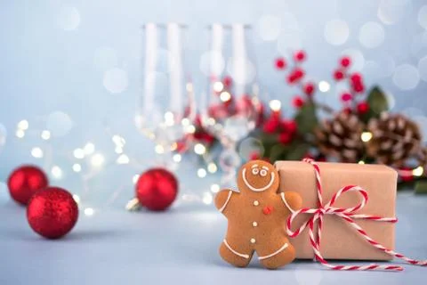 Festive background with gift, gingerbread man, Christmas decorations Stock Photos